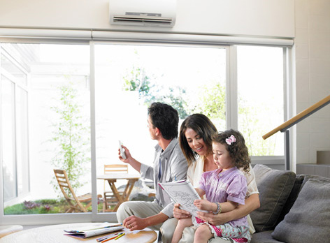 Family using their new Mitsubishi Electric wall split system in comfort